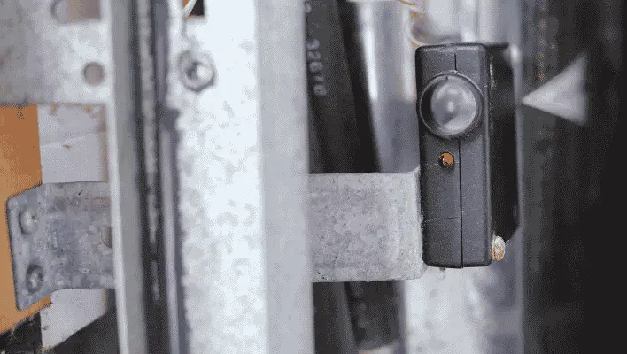 Garage door opener sensor beam is interrupted, the door stops or reverses.